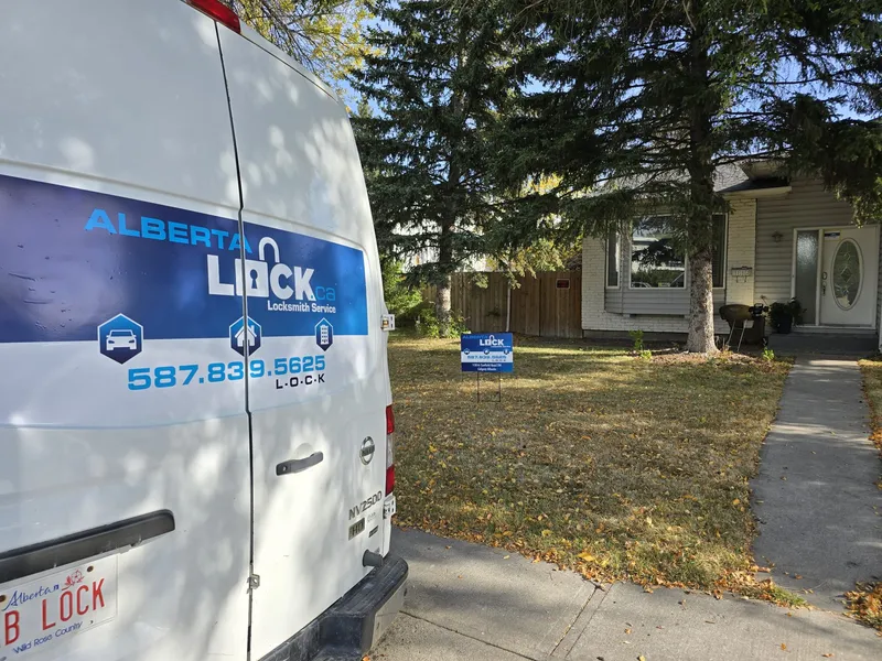 Alberta Lock service van parked at a residential job site