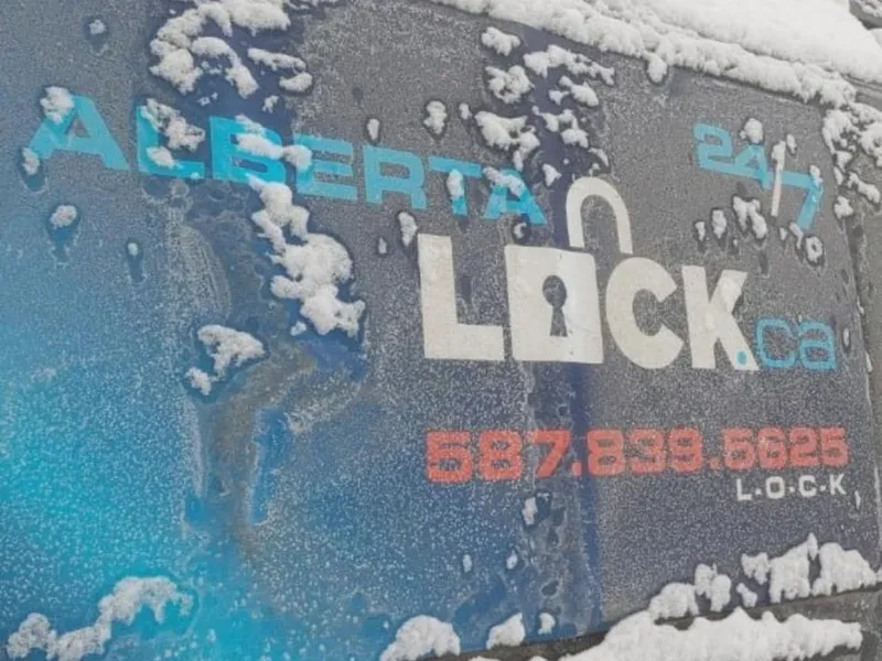 Alberta Lock service van with branding visible in winter