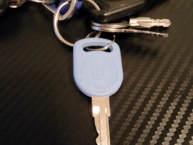 Keyring with a VW fob and blue key
