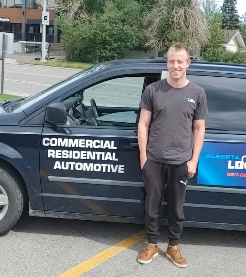 Drew MacIVER beside the Alberta Lock service van