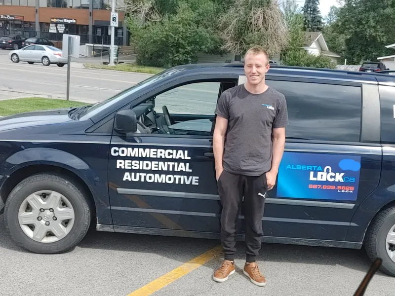 Drew beside the Alberta Lock service van