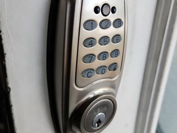 LSDA keypad deadbolt installed on a cream door
