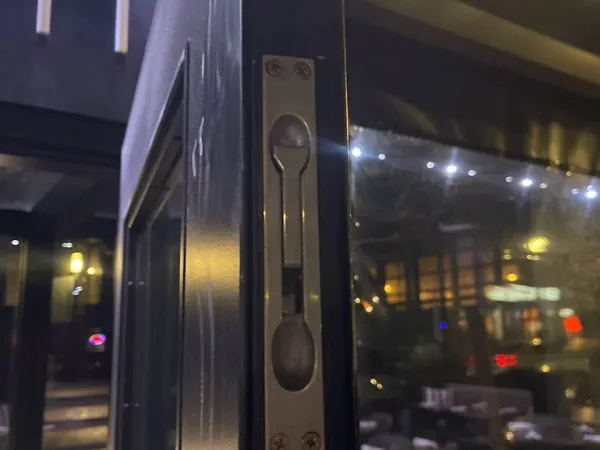 Restaurant storefront flush bolt installed