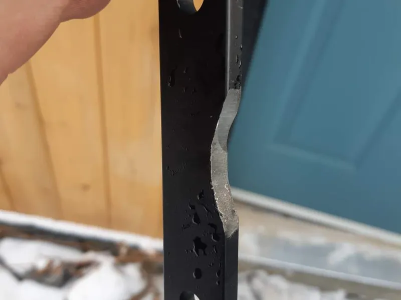 Worn security latch bar removed in the snow during an emergency call