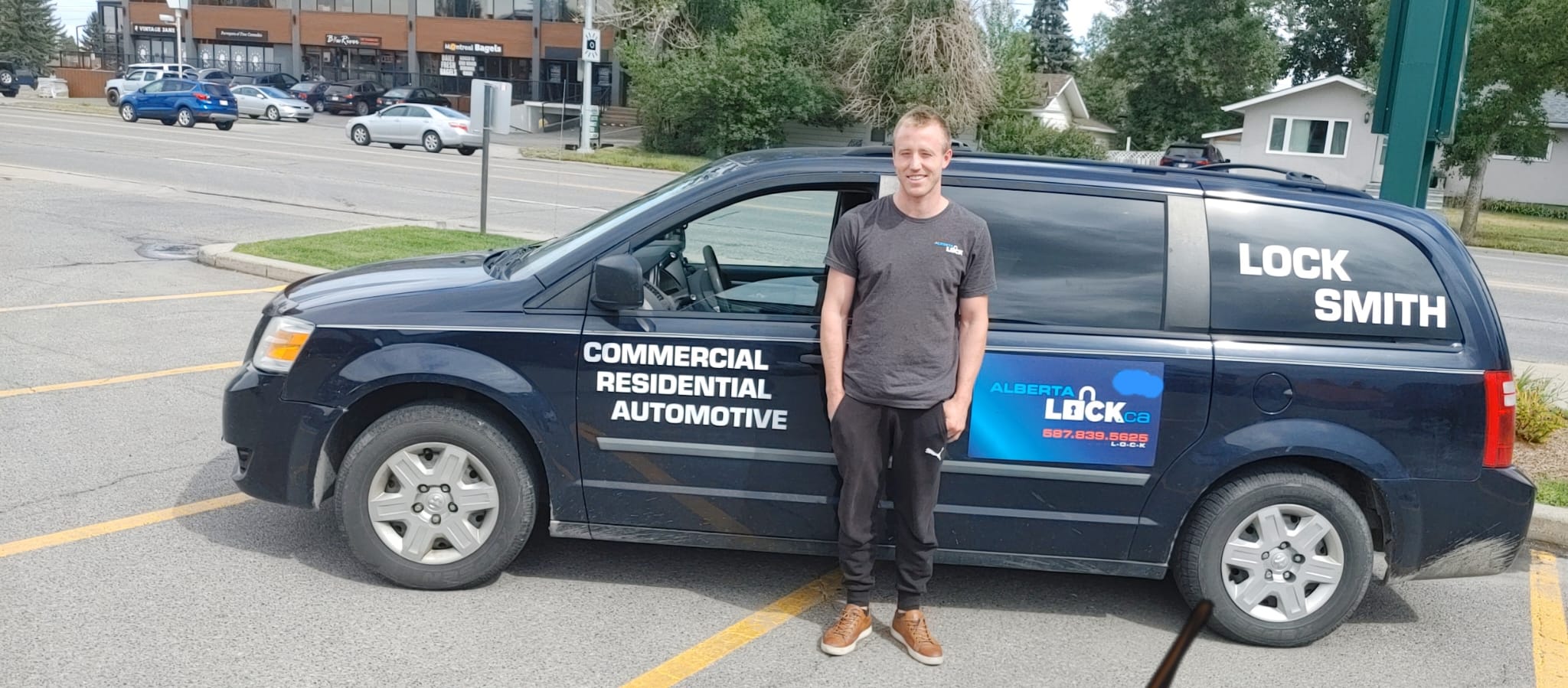 Drew MacIVER beside the Alberta Lock service van