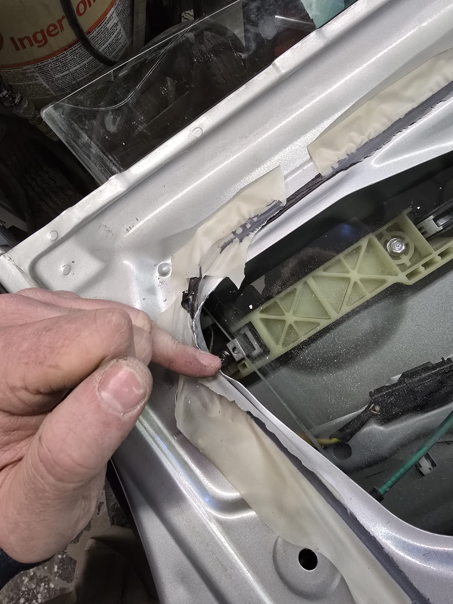 Silver car door panel disassembled for lock service