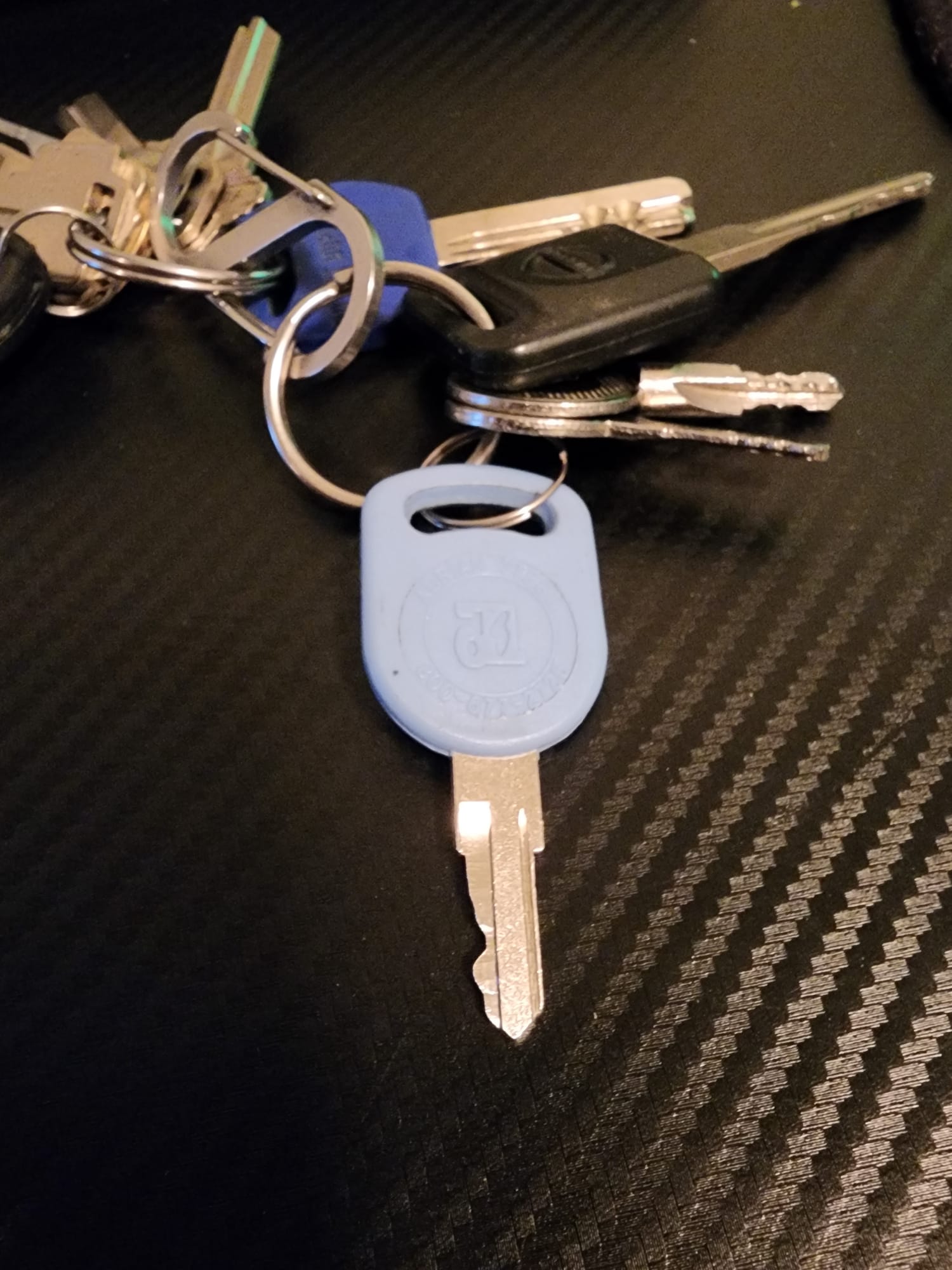 Keyring with a VW fob and blue key