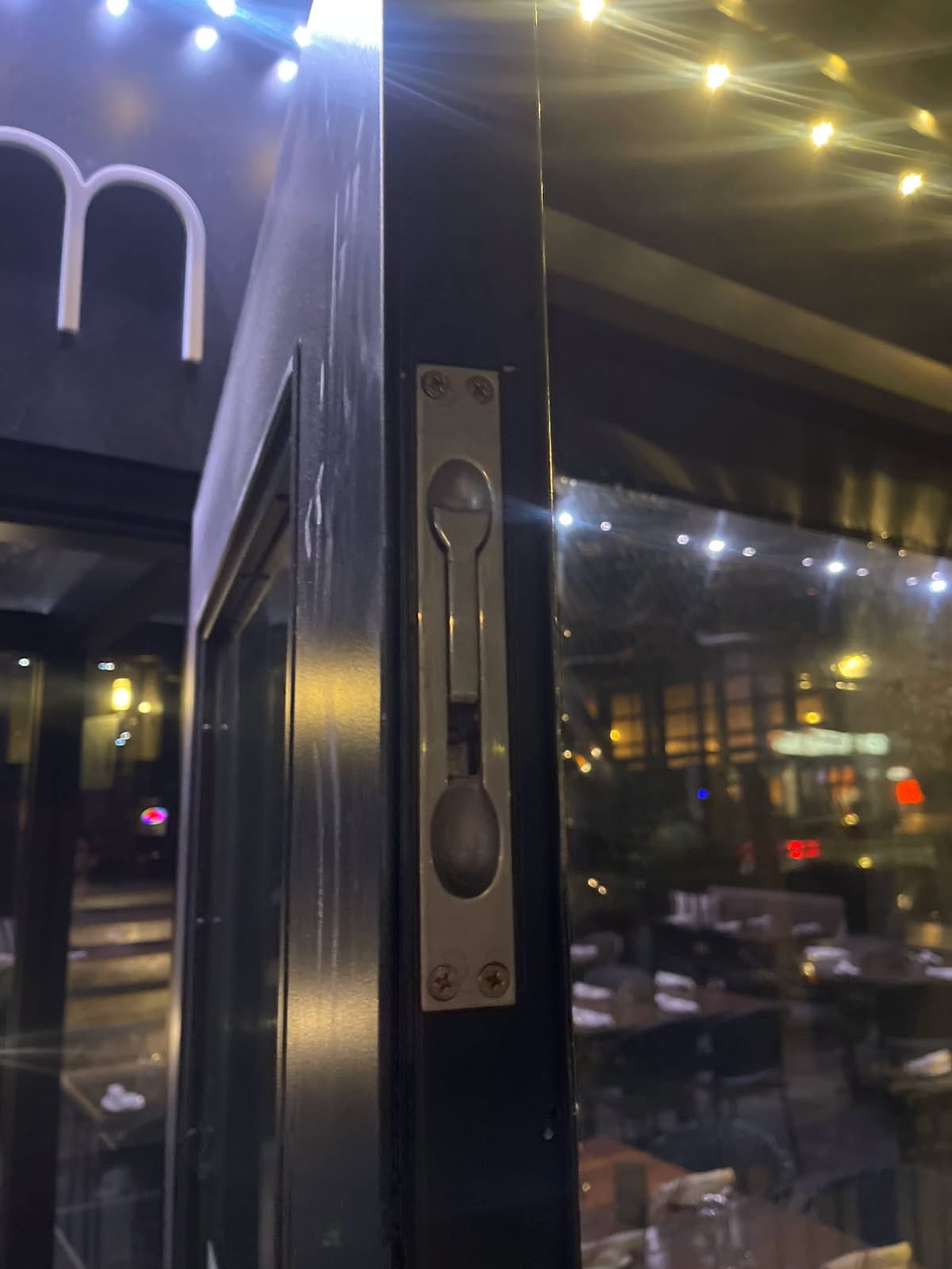 Restaurant storefront flush bolt installed