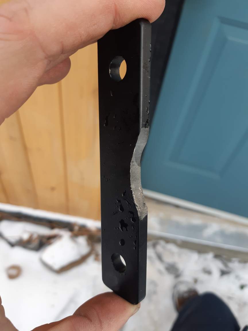 Worn security latch bar removed in the snow during an emergency call