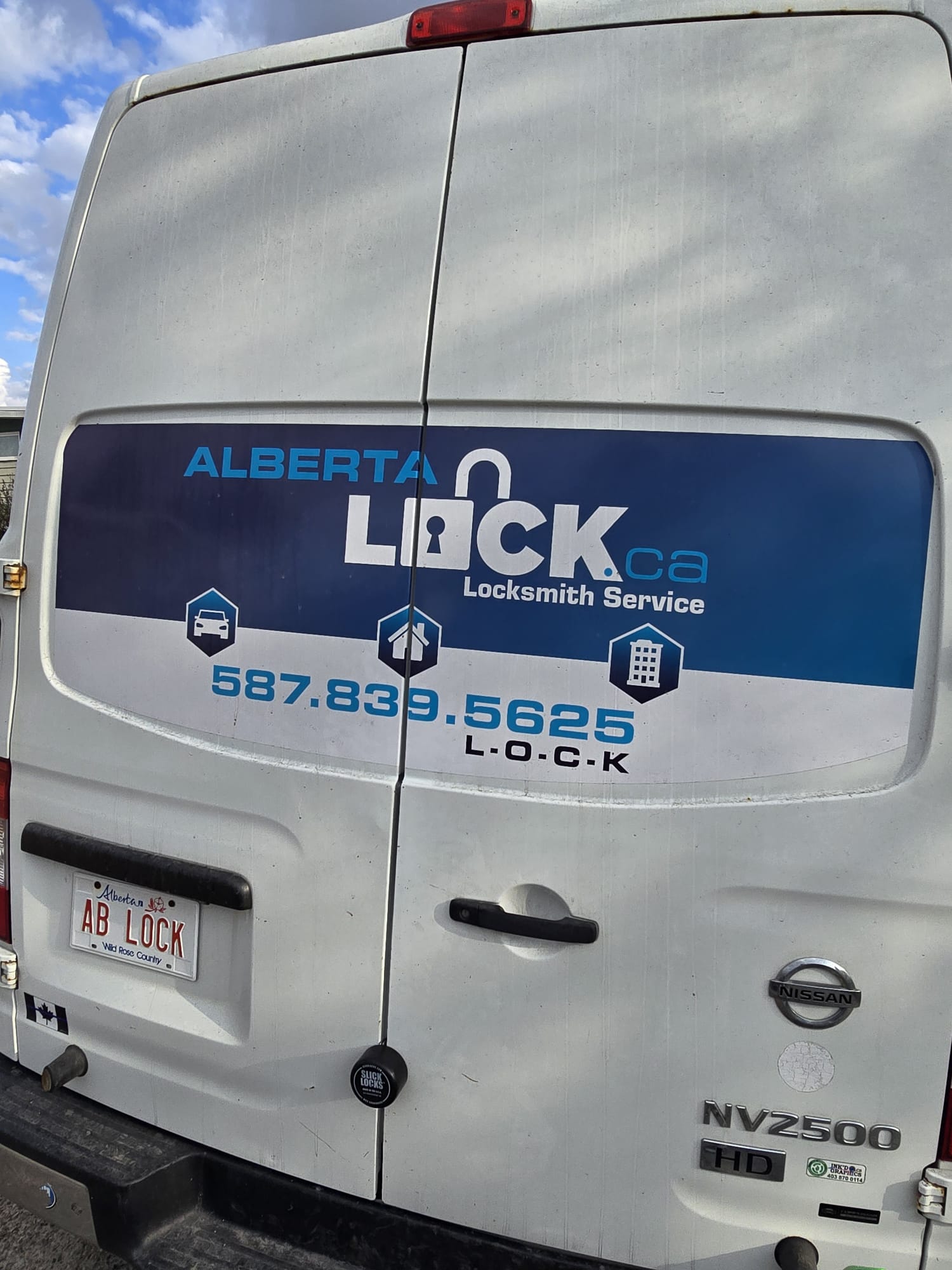 Alberta Lock Nissan NV2500 service van from the rear