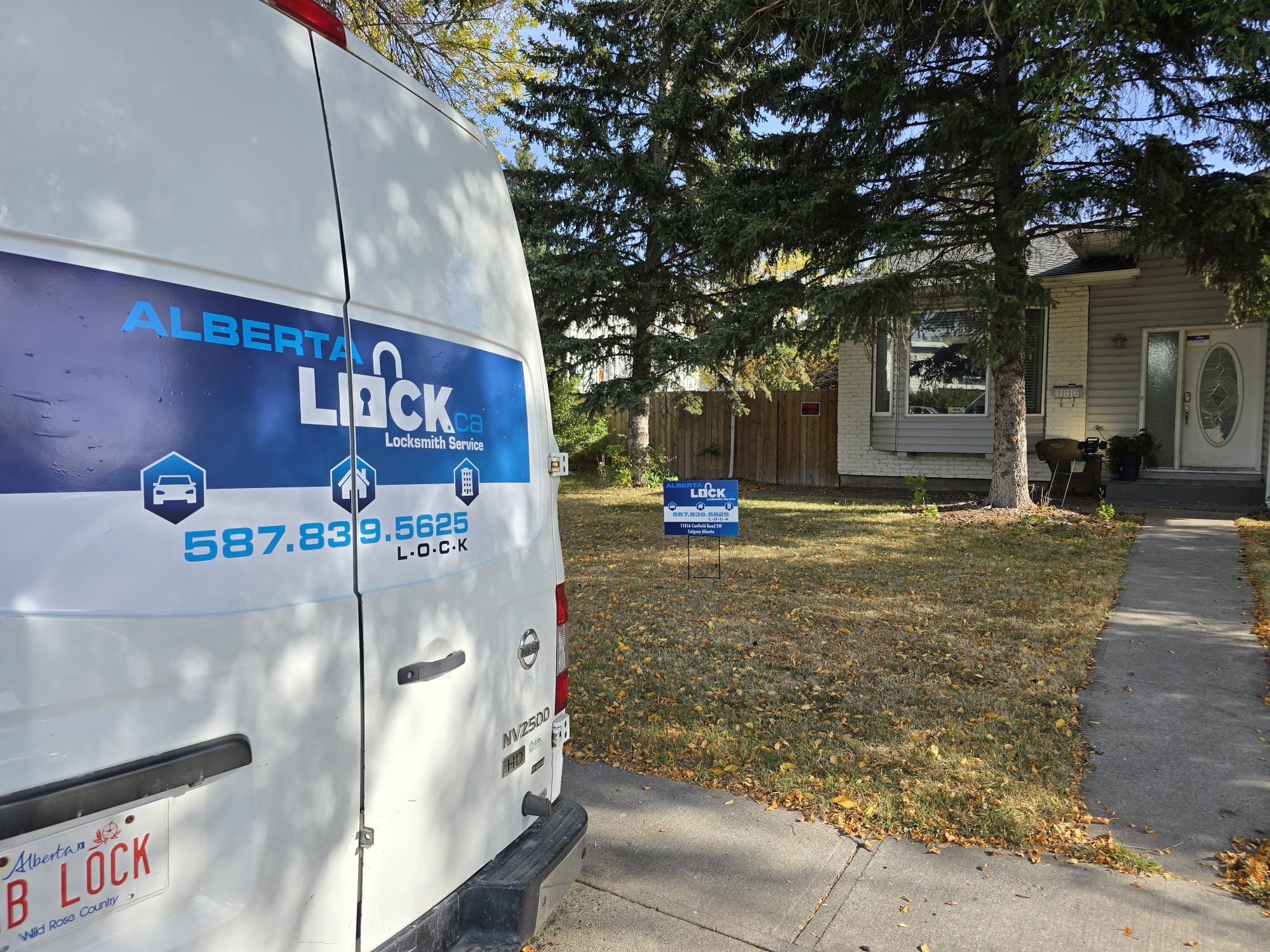 Alberta Lock service van parked at a residential job site