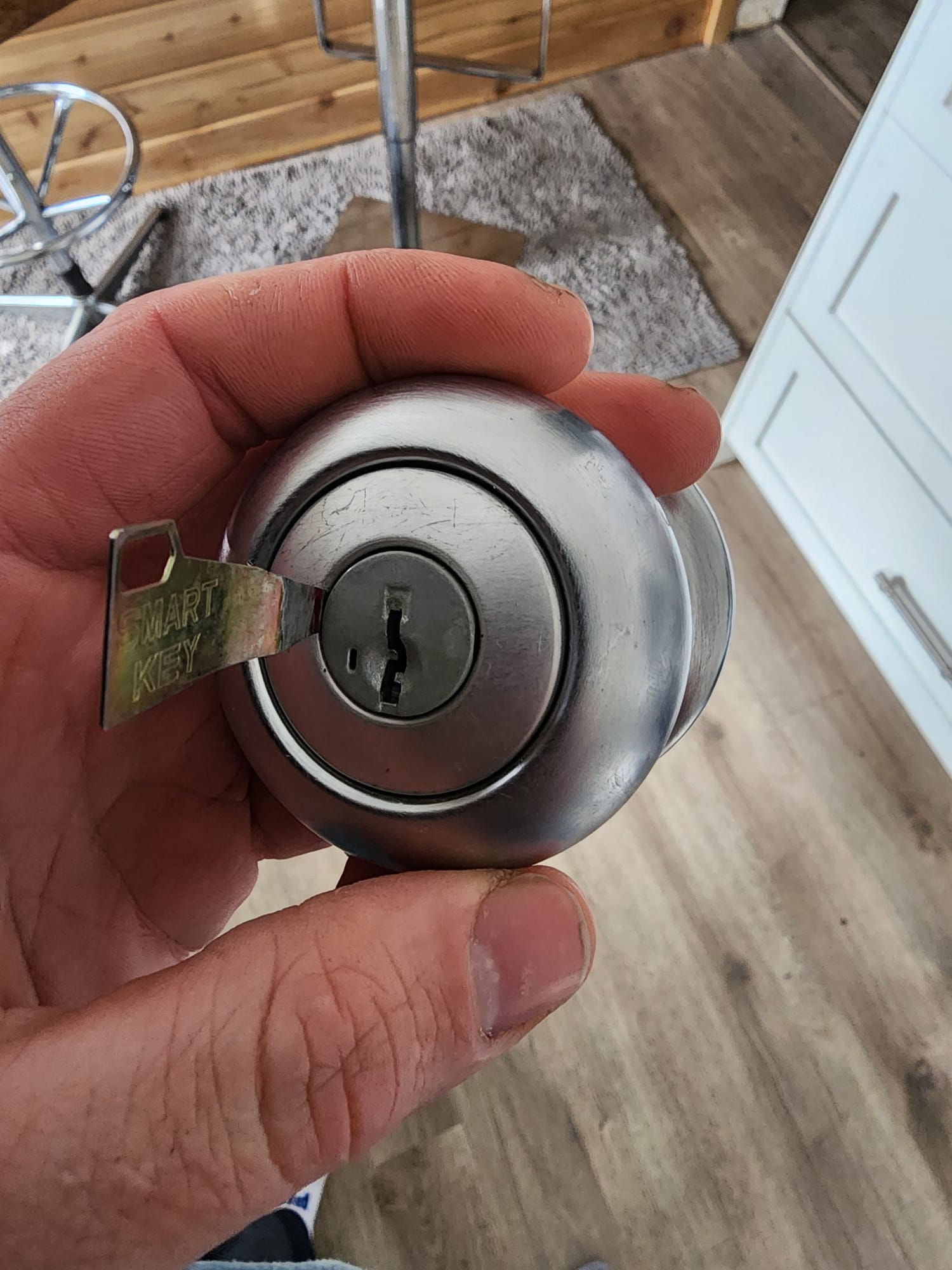 Kwikset SmartKey deadbolt being rekeyed with the manufacturer tool